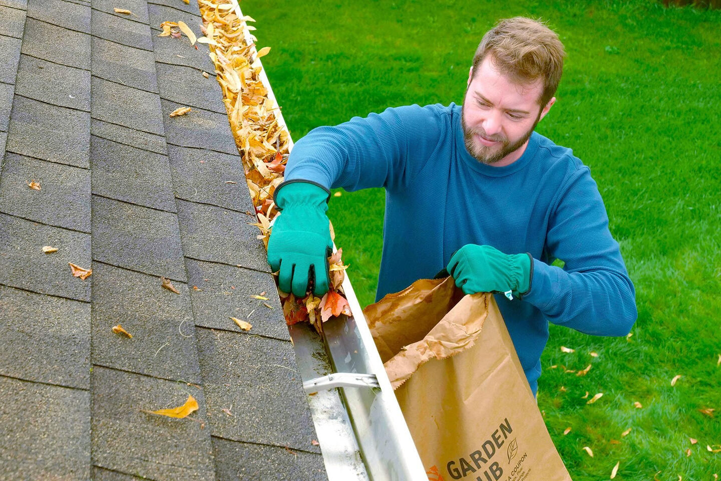 man cleaning gutters man cleaning gutters